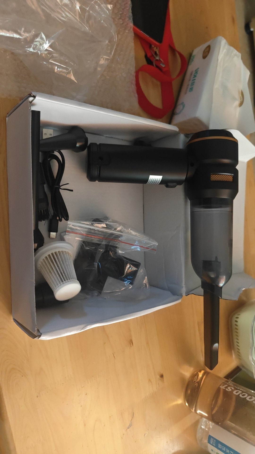 Buyer product photo — car vacuum in use